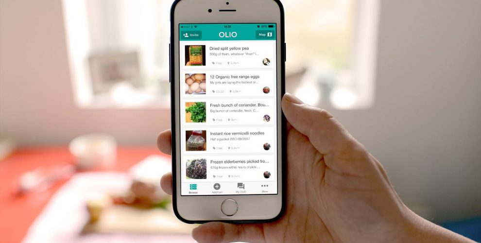 A person holding a phone showing the Olio food sharing app