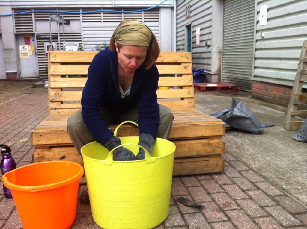 Most viewed blog post - me washing plastic items in a big yellow bucket.