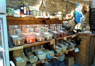 Food in dispensers on shelves