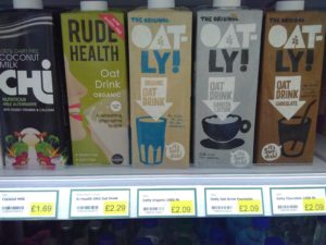 A range of plant milk in Tetrapak's on a shelf in a shop