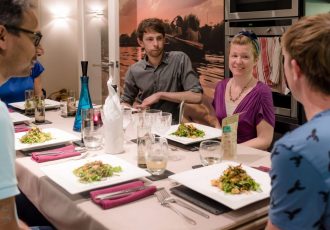 People sat around dining table