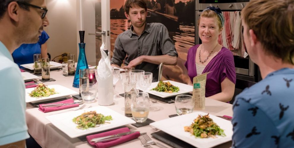 People sat around dining table