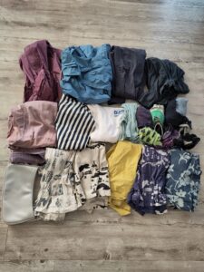 multiple items of clothing laid out on a floor