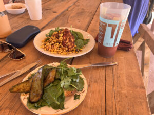 Festival food on two plates on a wooden table