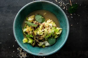 soup with wholegrain in blue bowl